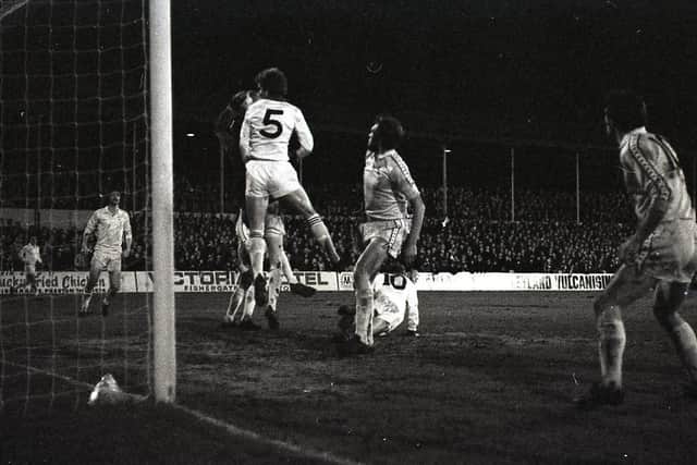 Preston centre-half Mick Baxter challenges in the air with the Charlton keeper