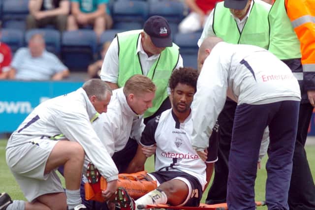 Youl Mawene is put on a stretcher after damaging knee ligaments