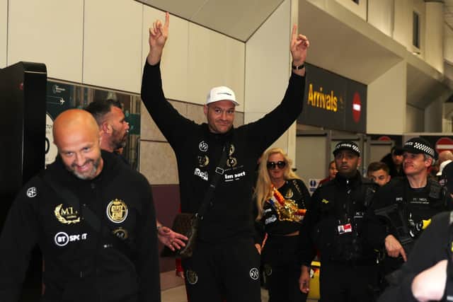 Morecambe ace Tyson Fury arriving back in Manchester on Tuesday morning