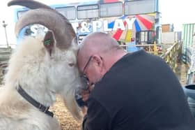 Damian Stanley pictured with his beloved goat Actin who recently passed away. 