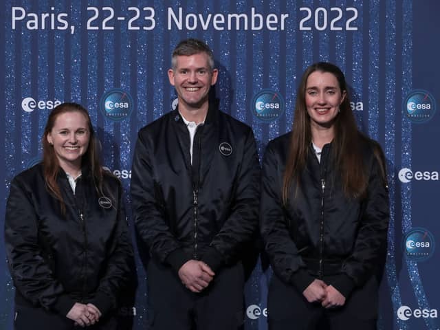 Meganne Christian (L), John McFall (C), and Rosemary Coogan (R) pose during a ceremony to unveil the European Space Agency new class of career astronauts in Paris on November 23, 2022