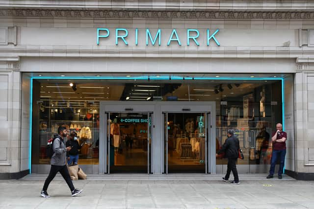 A pedestrian walks past a Primark store on Oxford Street.