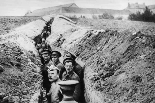 28th October 1914:  British soldiers lined up in a narrow trench during World War I.  (Photo by Hulton Archive/Getty Images)