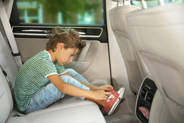 Encourage children to remove their muddy shoes when getting in a car (photo: adobe)