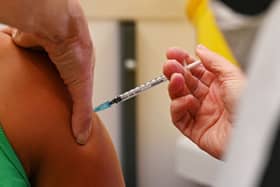 A member of the public receives a dose of the Pfizer BioNtech vaccine at a vaccination centre (Getty Images)