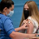 Teenager Eve Thomson receives a Covid-19 vaccination in Barrhead, Scotland (Photo: Jeff J Mitchell/Getty Images)