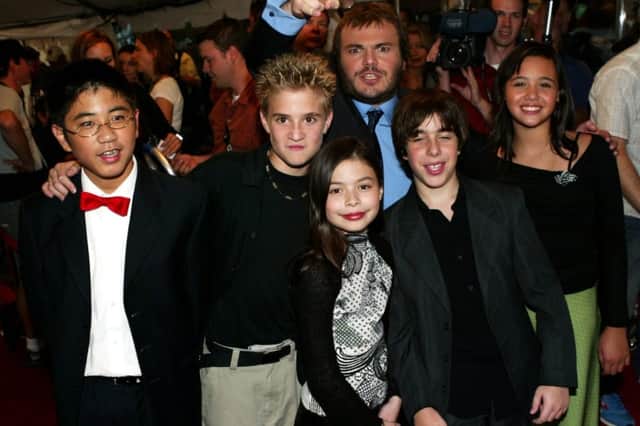 Jack Black (back) with the child cast members (L-R) Robert Tsei, Kevin Clark, Miranda Cosgrove, Joey Gaydos, and Rivkah Reyes attend the gala screening for 'School of Rock' during the 2003 Toronto International Film Festival (Photo: Donald Weber/Getty Images)