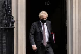 Prime Minister Boris Johnson leaves 10 Downing Street to attend the weekly Prime Ministers Questions in Parliament on April 21 (Photo by Dan Kitwood/Getty Images)