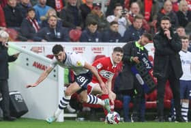 Tom Cannon evades a challenge from Middlesbrough’s Darragh Lenihan