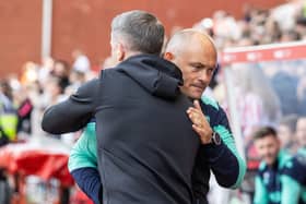 Preston North End's manager Ryan Lowe (left) is greeted by Stoke City's manager Alex Neil