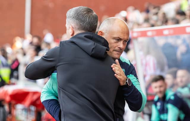 Preston North End's manager Ryan Lowe (left) is greeted by Stoke City's manager Alex Neil