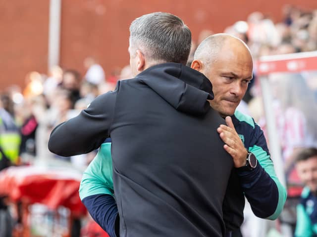 Preston North End's manager Ryan Lowe (left) is greeted by Stoke City's manager Alex Neil
