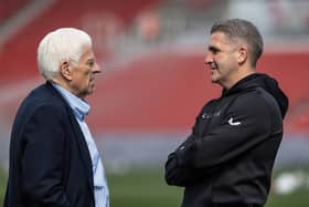 Preston North End director Peter Ridsdale (left) chats to manager Ryan Lowe before the match 
