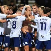 Preston North End's Milutin Osmajic is congratu