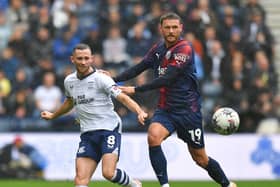 Preston North End's Alan Browne battles with West Bromwich Albion's John Swift