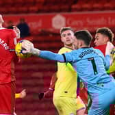 Middlesbrough player Rav van den Berg diverts the ball to score 