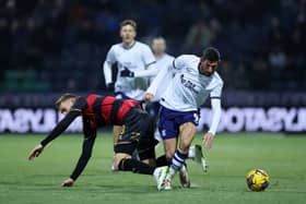 Ched Evans of Preston North End is challenged by Sam Field of Queens Park Rangers