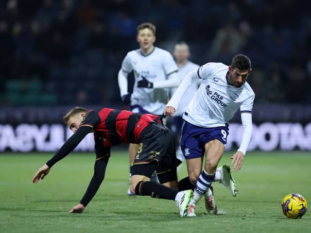 Ched Evans of Preston North End is challenged by Sam Field of Queens Park Rangers