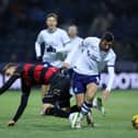Ched Evans of Preston North End is challenged by Sam Field of Queens Park Rangers
