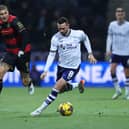 QPR striker Lyndon Dykes chases down Alan Browne during last night's Championship game at Deepdale