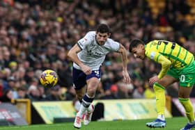 Preston North End's Ched Evans battles for possession with Norwich City's Dimitris Giannoulis