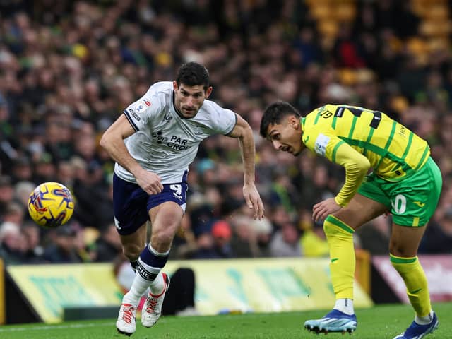 Preston North End's Ched Evans battles for possession with Norwich City's Dimitris Giannoulis