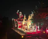 Santa waves to children from his sleigh as he visits the streets of Penwortham at Christmas
