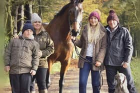 Mandy and Richard with their two children Annabel and Harry, as well as their dog.