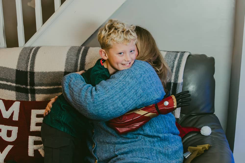 10-year-old Harry is able to give his Nan a two-armed hug.