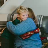 10-year-old Harry is able to give his Nan a two-armed hug.