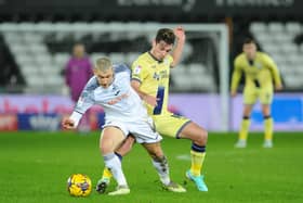 Preston North End's Ryan Ledson battles with Swansea City's Jay Fulton