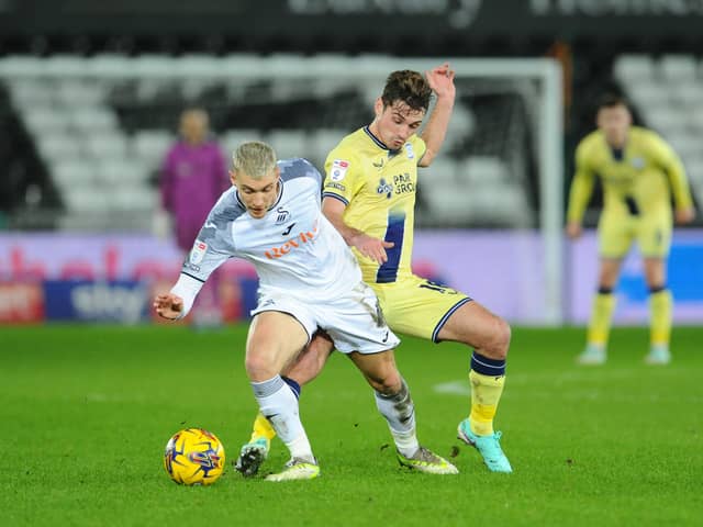 Preston North End's Ryan Ledson battles with Swansea City's Jay Fulton