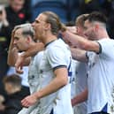 The Preston North End players celebrate Liam Millar's winner in front of the packed stands at Deepdale