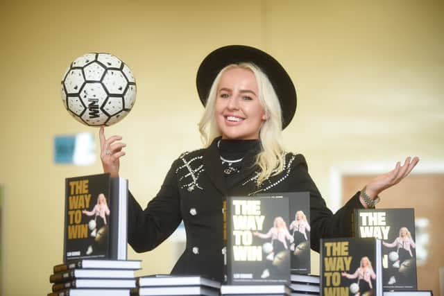 Liv during a book signing at Balshaw's Church of England High School