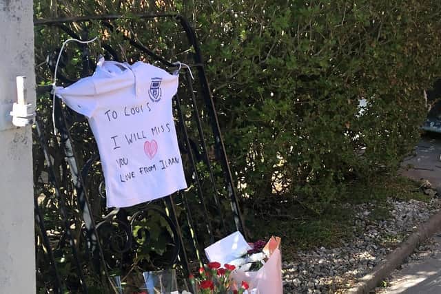 School T-shirt left by one of the children’s friends with “To Louis, I will miss you” written on it