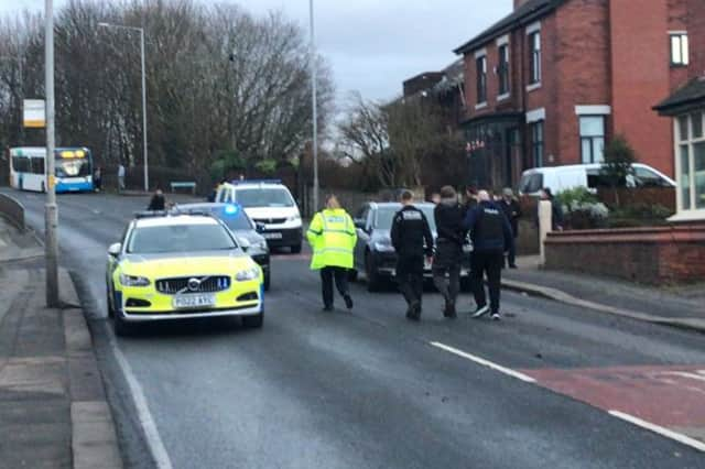 The young driver was arrested and led into the back of a police van