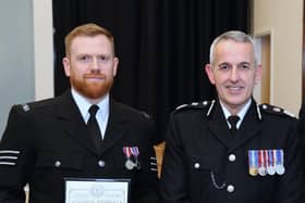 Chief Constable Chris Rowley and PS Timperley being presented with his award (Credit: Lancashire Police)