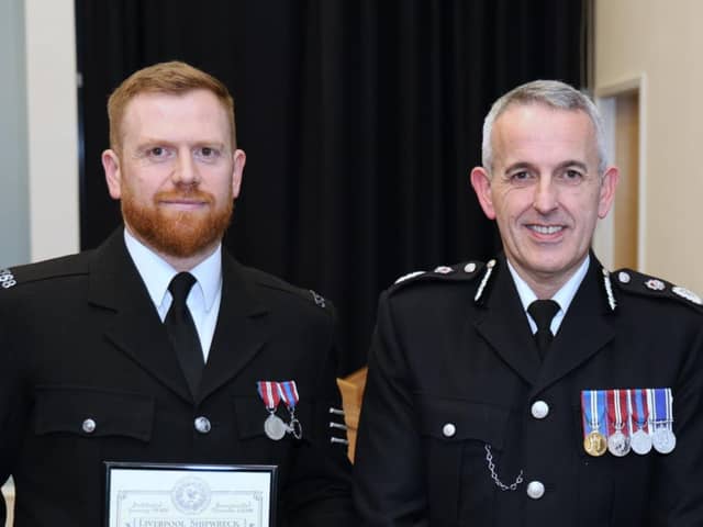 Chief Constable Chris Rowley and PS Timperley being presented with his award (Credit: Lancashire Police)