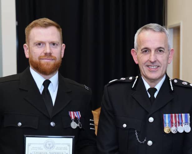 Chief Constable Chris Rowley and PS Timperley being presented with his award (Credit: Lancashire Police)