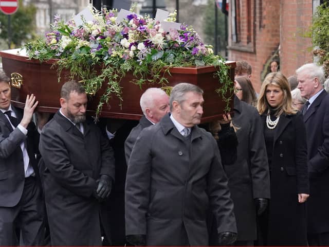 Kate Garraway follows the coffin into the funeral service of her husband Derek Draper. 