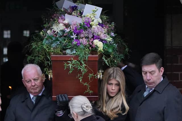 Derek and Kate's daughter Darcey carrying the coffin at her father's funeral.