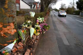 Flowers left at the scene of a fatal crash in Hesketh Lane, Tarleton, where a 50-year-old man and a 17-month-old girl were killed on Sunday morning (February 4)
