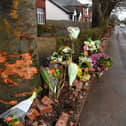 Flowers left at the scene of a fatal crash in Hesketh Lane, Tarleton, where a 50-year-old man and a 17-month-old girl were killed on Sunday morning (February 4)