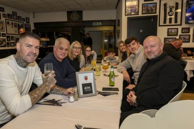 Shane enjoying a drink at the football club.