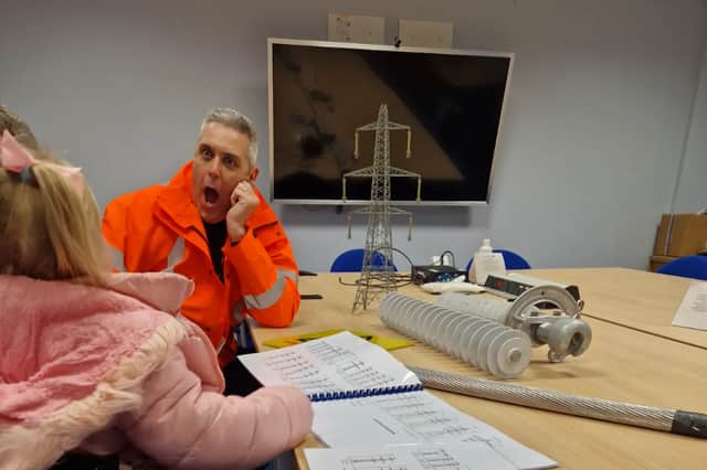 4-year-old Lucy, from Blackpool chats to National Grid’s Network Engineering manager Wayne Steel, who conducted the site tour for the family.