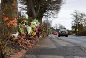 Flowers in tribute to David Beckett and his 17-month-old daughter Darcy at the scene of the fatal crash in Hesketh Lane, Tarleton on Sunday, February 4