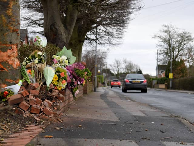 Flowers in tribute to David Beckett and his 17-month-old daughter Darcy at the scene of the fatal crash in Hesketh Lane, Tarleton on Sunday, February 4