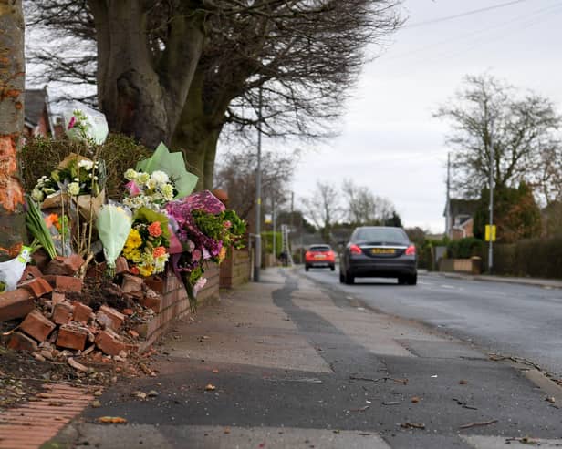 Flowers in tribute to David Beckett and his 17-month-old daughter Darcy at the scene of the fatal crash in Hesketh Lane, Tarleton on Sunday, February 4