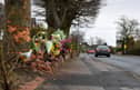 Flowers in tribute to David Beckett and his 17-month-old daughter Darcy at the scene of the fatal crash in Hesketh Lane, Tarleton on Sunday, February 4