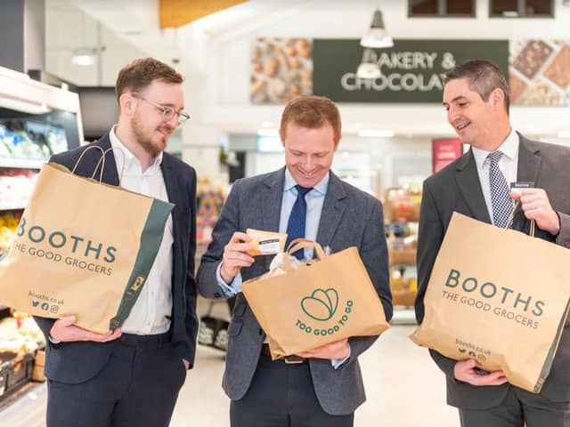 Too Good to Go founder Jamie Crummie meeting Environment Minster Robbie Moore at Booths MD Nigel Murray at Booths Ilkley launching the food waste app across 27 Booths stores. 